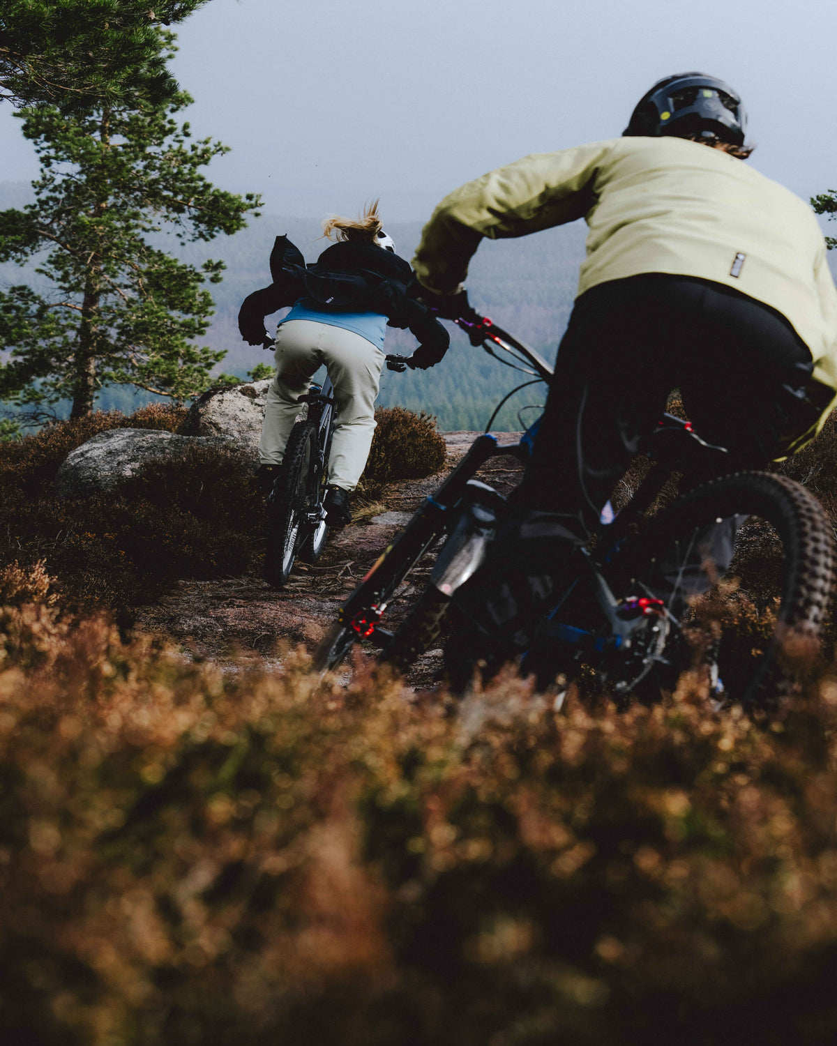 Three people cycling in the mountains